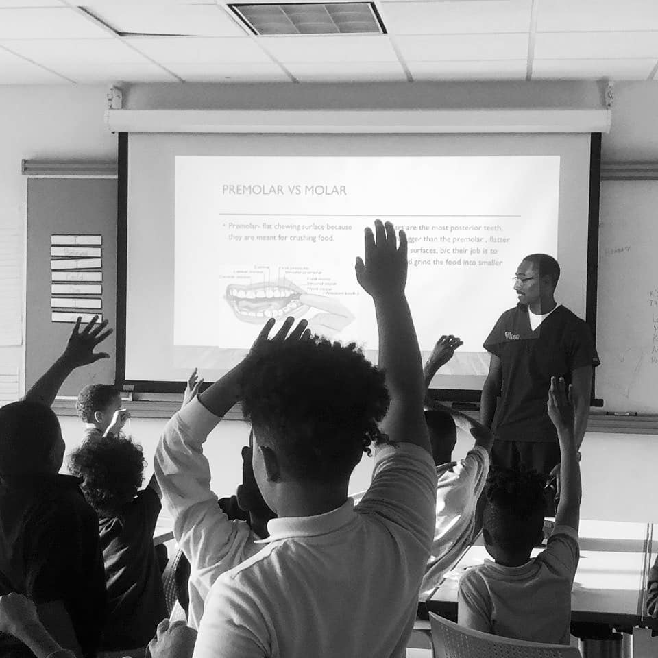 Dr. Kindred teaching dental health to students